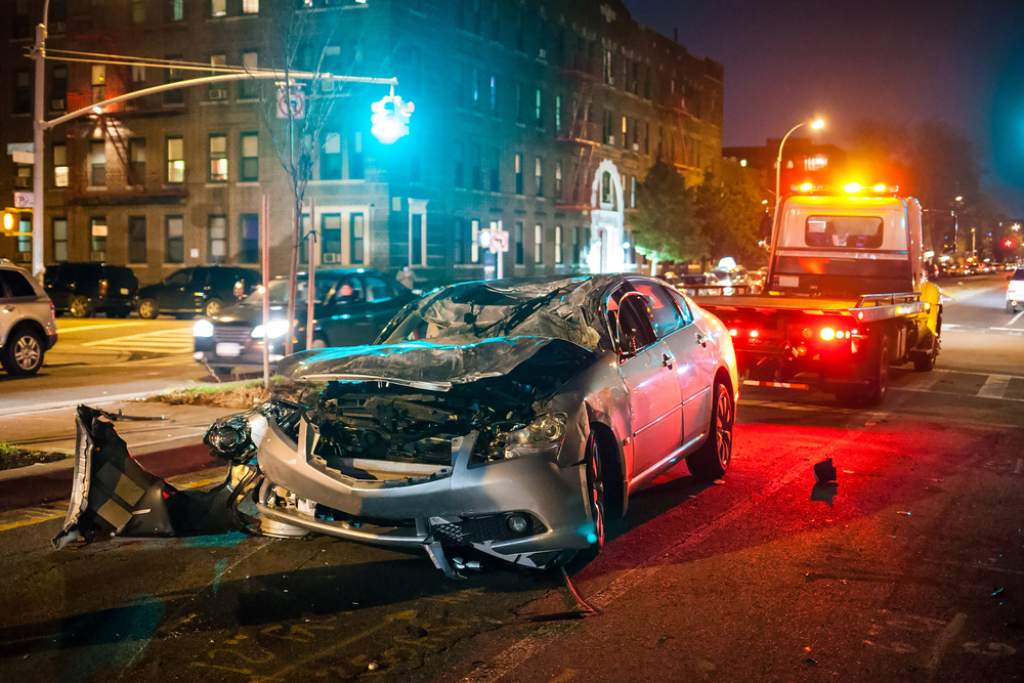 The aftermath of a bad car accident at night